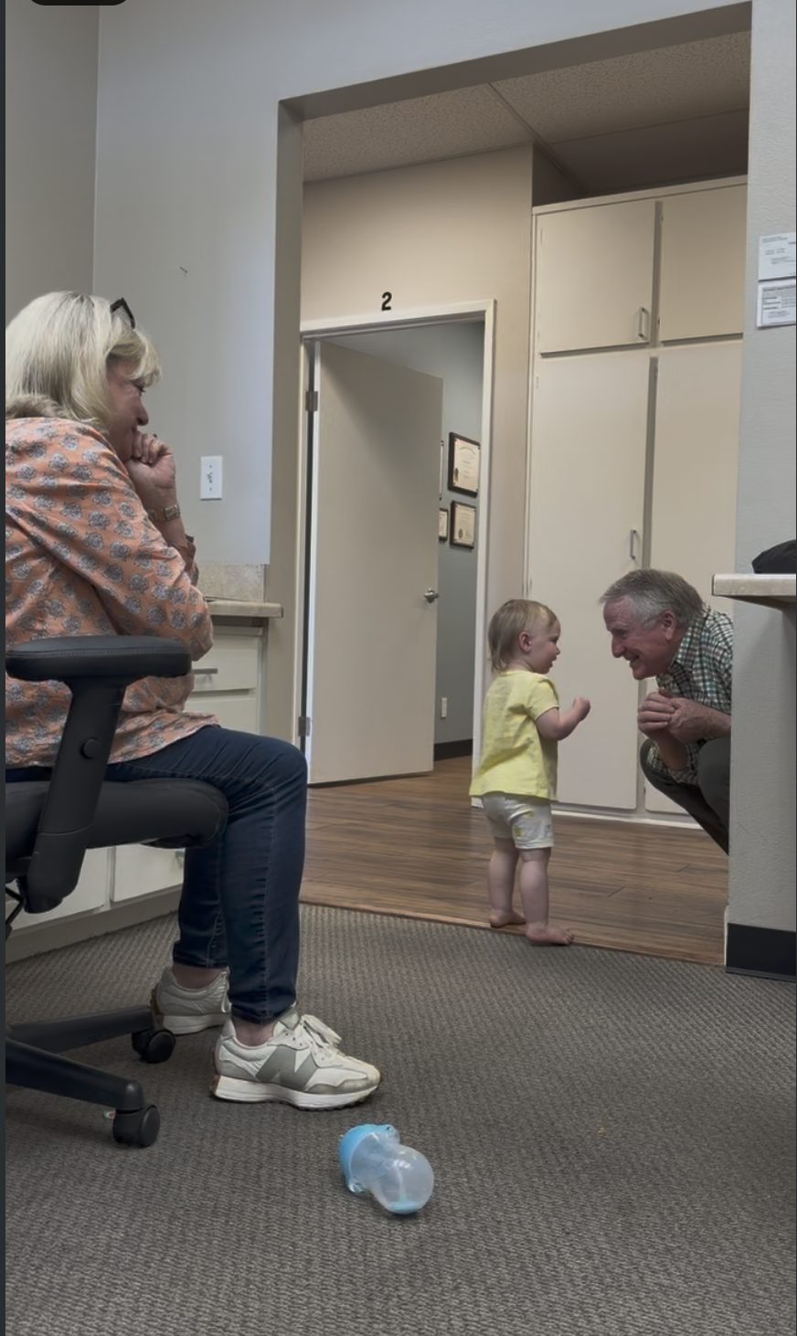 Dr. Monahan with his grandchild at the office